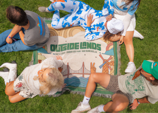 people sitting on an outsidelands blanket