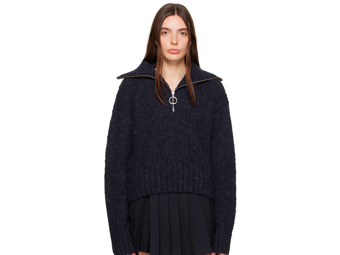 A navy zip-up, light sweater