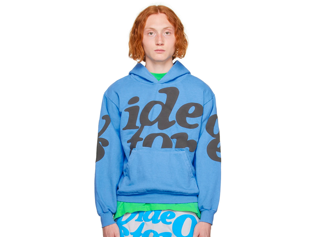 Blue hoodie with brown puff print that reads 'video store'.