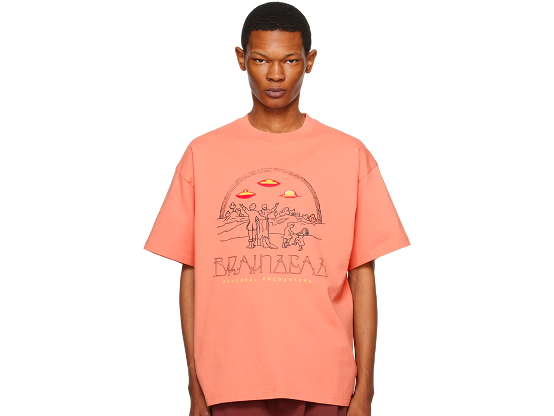 orange t shirt that features a red graphic