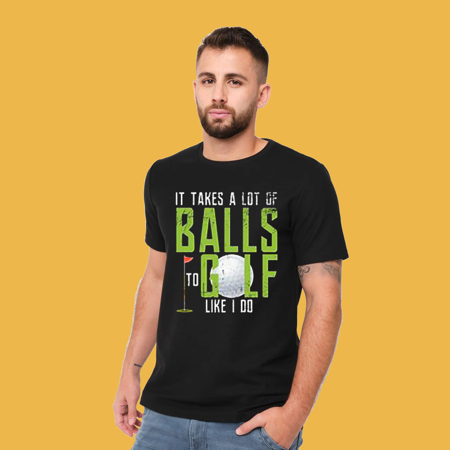 A man wearing a black graphic tee shirt. It has the words 'It takes a lot of balls to golf like I do.'