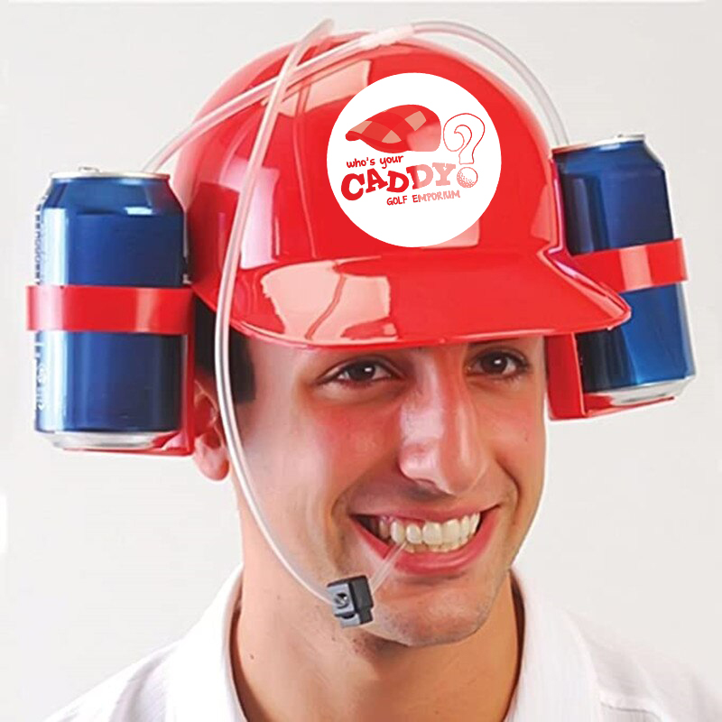 Close-up photo of a man wearing a funny red plastic hat. The hat has a holder on each side which each hold a blue can of soda. There is a straw leading from the tops of both of the cans, down to the man's mouth.